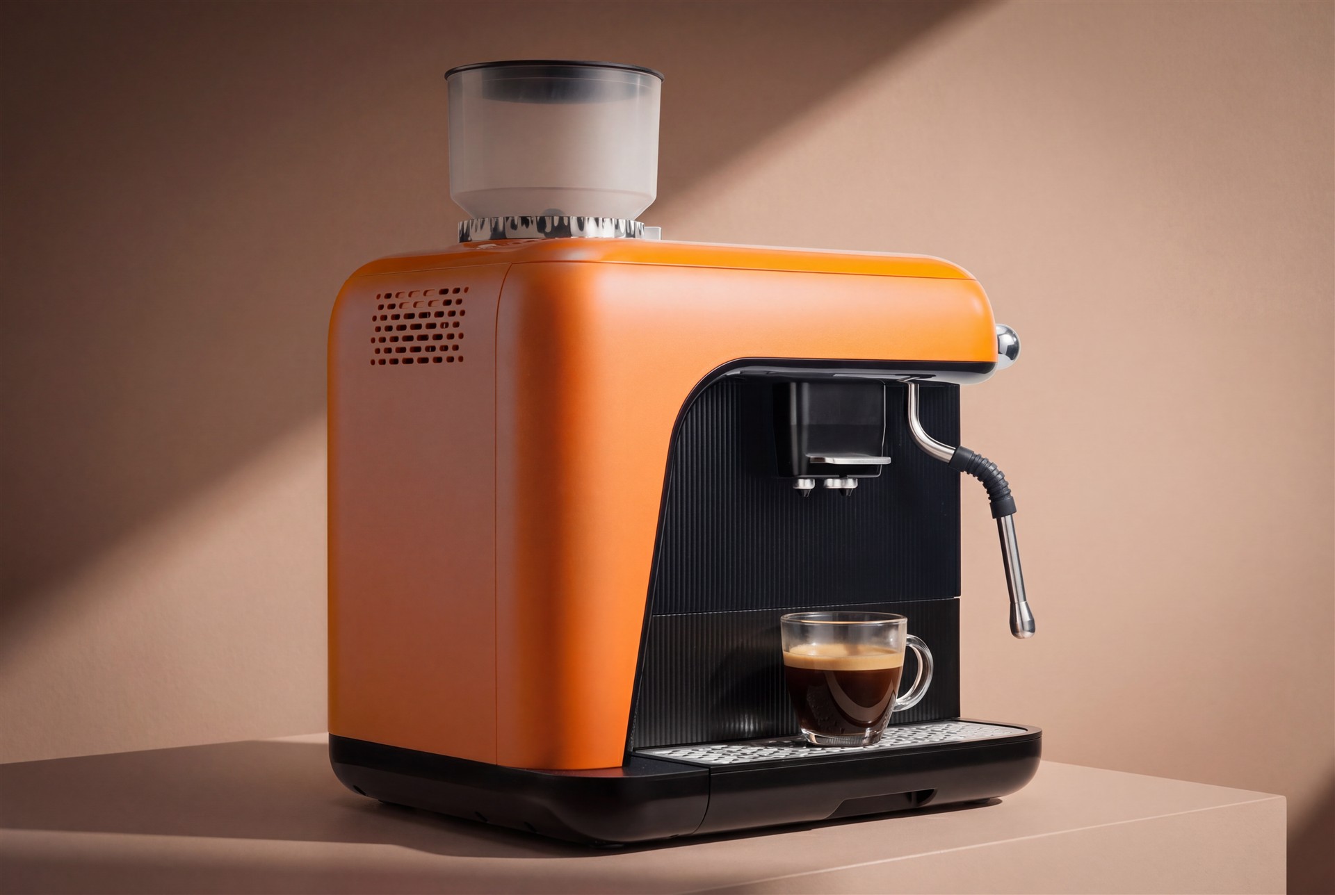 An orange yeema coffee machine beside an espresso in warm studio light